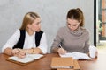 Two women are studying and teaching Royalty Free Stock Photo