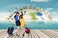 Two women with suitcase and the world landmark Royalty Free Stock Photo