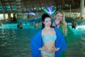 Two women in swimwear and bathrobes pose in big Royalty Free Stock Photo