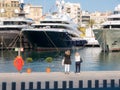 Two women taking luxury yachts in picture