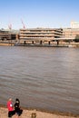 Two Women Talking on the Banks Of The River Thames London United