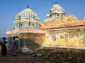 Two women talking outside the colorful Hindu temple of Masilamaninathar at Fort