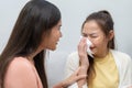 Two women talking about problems at home. Asian women embrace to calm their sad best friends from feeling down. Female friends Royalty Free Stock Photo