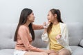 Two women talking about problems at home. Asian women embrace to calm their sad best friends from feeling down. Female friends Royalty Free Stock Photo