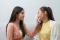 Two women talking about problems at home. Asian women embrace to calm their sad best friends from feeling down. Female friends Royalty Free Stock Photo