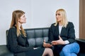 Two women are talking on the sofa Royalty Free Stock Photo