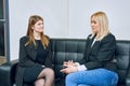 Two women are talking on the sofa Royalty Free Stock Photo