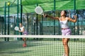 Two women tennis players playing padel Royalty Free Stock Photo