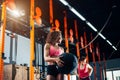 Fitness and exercising concept - two woman with medicine balls training in gym Royalty Free Stock Photo