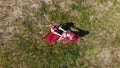 Two women in traditional Russian clothes do the roundelay on the meadow