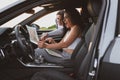 two girls travel the roads in a car, look at the map. Vacation concept Royalty Free Stock Photo