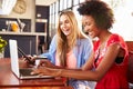 Two women using computers in a coffee shop Royalty Free Stock Photo