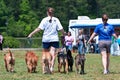 Two Women Walk Their Dogs At Dog Festival