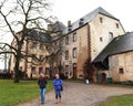 Women walking in front of an historic building in Dudeldorf, Germany