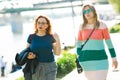 Two women walking along the waterfront