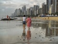 Women walking by the sea