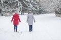 Two women walking on an empty, snowy street in Dnepr, Ukraine at December, 03 2016