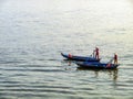 Two women rowing a boat