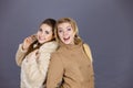 Two women wearing light brown coats Royalty Free Stock Photo