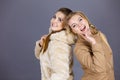 Two women wearing light brown coats Royalty Free Stock Photo