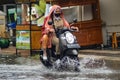 two women were returning home from work on a motorbike which broke through the flood during heavy rain