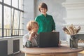 Two women working laptop 40 and 60 years old Royalty Free Stock Photo