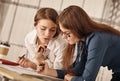 Two women working together at an architect s office. Royalty Free Stock Photo