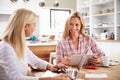 Two women working together at home Royalty Free Stock Photo