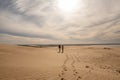 Two womens walks through the dunes of the Cabo Polonia National Park in the Department of Rocha in Uruguay Royalty Free Stock Photo