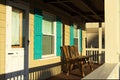 Two wood chairs sit empty on porch Ã¢â¬â Hampton Beach