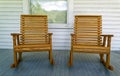 Two wood rocking chairs set on a white wood porch Royalty Free Stock Photo