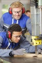 two wood workers in carpentry cutting boards Royalty Free Stock Photo