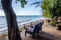 Two wooden armchairs on the terrace overlooking the sea Indian Ocean, among tropical trees and plants, Pemba Island, Tanzania Royalty Free Stock Photo