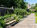 Two wooden benches in a flower garden in city owned Mellon Park in Pittsburgh, Pennsylvania, USA Royalty Free Stock Photo