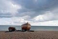 Two small boats moored by the sea along the south coast Royalty Free Stock Photo