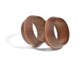 Two wooden bracelets in the form of rings on a white background Royalty Free Stock Photo