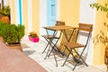 Two wooden chairs with table on the street Royalty Free Stock Photo