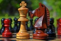 Two Wooden Chess Pieces on a Chess Board. Generative AI Royalty Free Stock Photo