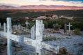 Two wooden cross grave markers overlooking sunset over hills in Boothill graveyard in Tombstone Royalty Free Stock Photo