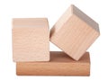 two wooden cubes on one brick create construction isolated on the white Royalty Free Stock Photo