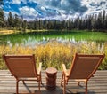 Two wooden deckchairs for tourists