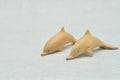 Two wooden dolphin figurines Royalty Free Stock Photo