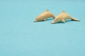 Two wooden dolphin figurines Royalty Free Stock Photo