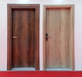 Two wooden doors red carpet