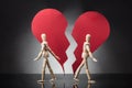 Two Wooden Dummy Standing Against Each Other With Broken Heart Royalty Free Stock Photo