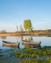 two wooden fishing boats in the lake. Royalty Free Stock Photo