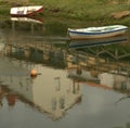 Two wooden fishing boats stranded in an estuary (Ortigueira, Spain) Royalty Free Stock Photo