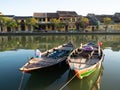 Two Wooden Fishing Boats in the Thu Bon River in Hoi An, Vietnam Royalty Free Stock Photo