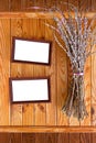 Two wooden frames with bunch of willow