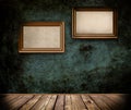 Two wooden frames on a grunge wall. Royalty Free Stock Photo